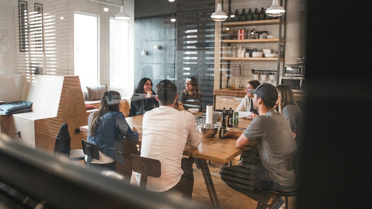Team working together at computers in a bright office